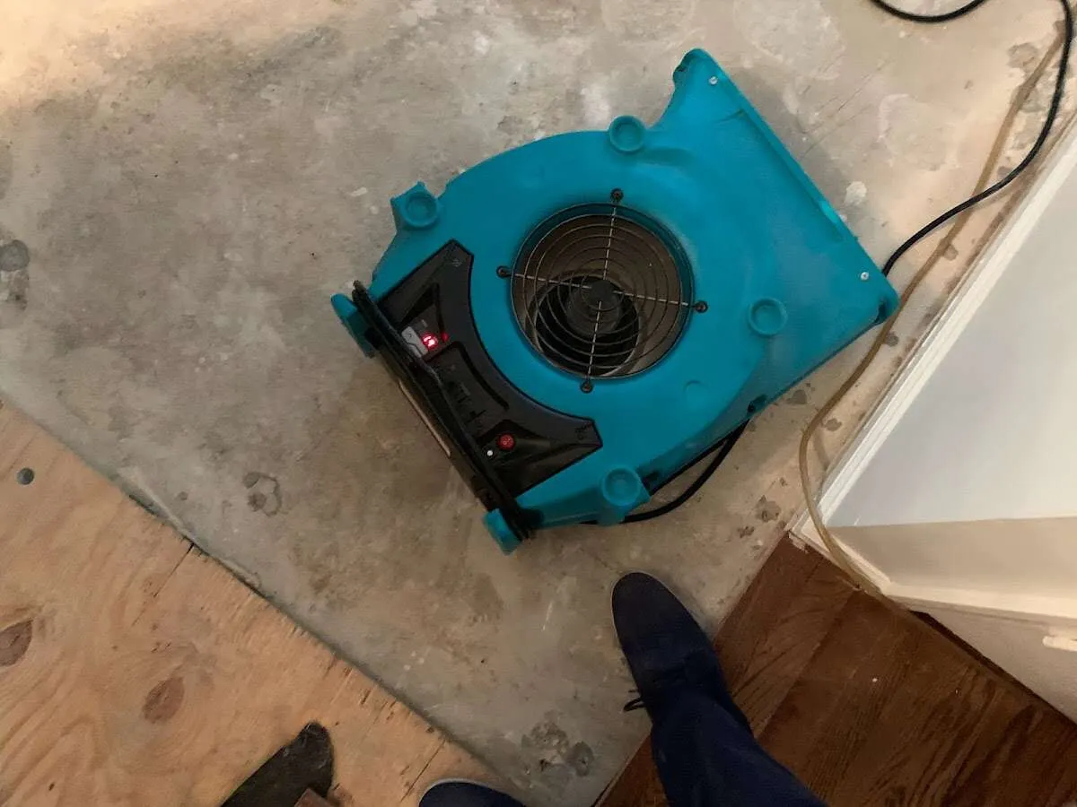 Air mover drying subfloor during Commercial Water Damage Restoration in Jennings Lodge